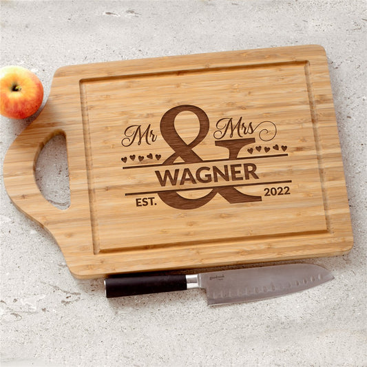 Personalized Mr and Mrs bamboo wedding cutting board engraved with last name and established year