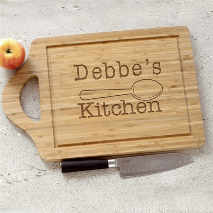 Personalized bamboo cutting board engraved with a custom kitchen name