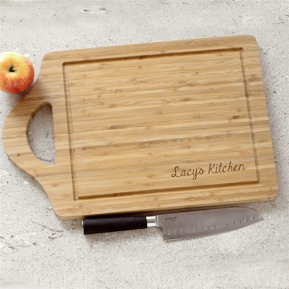 Personalized bamboo cutting board engraved with a family name or kitchen name