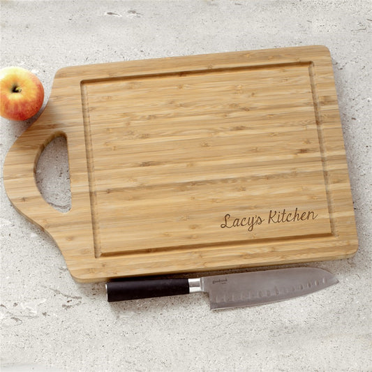 Personalized bamboo cutting board engraved with a family name or kitchen name