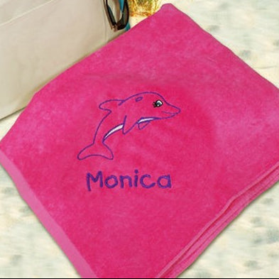 Pink towel embroidered with a dolphin design and name