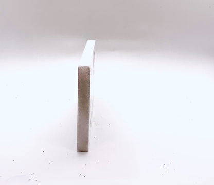 a small rectangular object sitting on top of a white floor